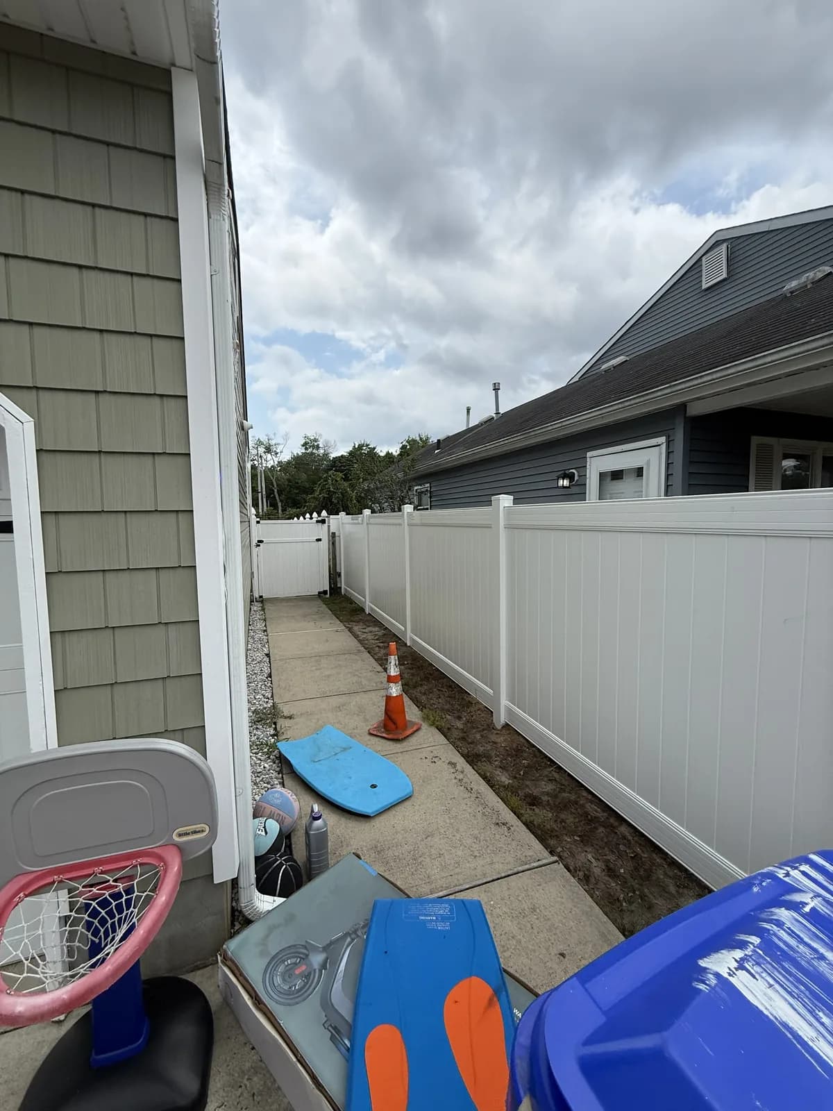 Property-Line Privacy โ white vinyl privacy fence installed by Sandy Shores Fences in Brick, NJ